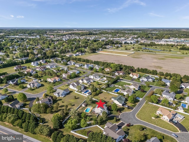 birds eye view of property with a residential view