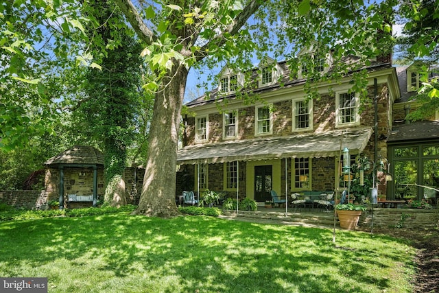 805 Evans Rd, Gwynedd Valley, PA 19437 - rear view of house with a lawn, stone siding, and french doors