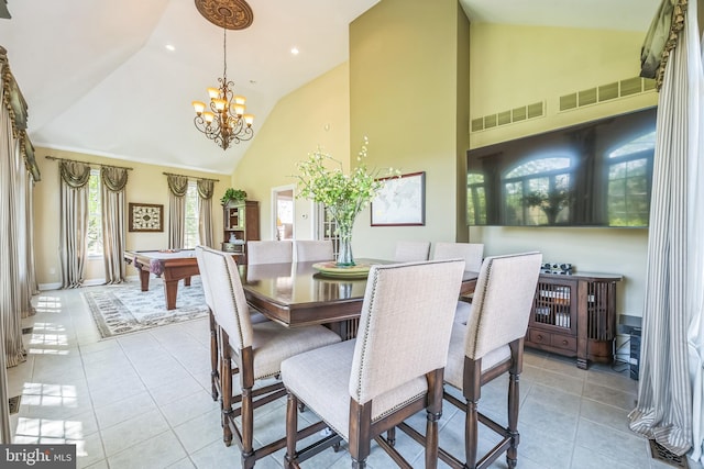 tiled dining space with visible vents, billiards, high vaulted ceiling, and an inviting chandelier