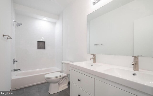 727 N 39th St, Philadelphia, PA 19104 - full bath featuring double vanity, toilet, tile patterned floors, and a sink