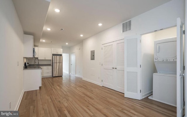727 N 39th St, Philadelphia, PA 19104 - interior space featuring visible vents, stacked washer / drying machine, baseboards, light wood-style floors, and recessed lighting