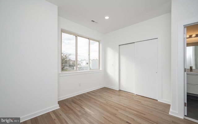 727 N 39th St, Philadelphia, PA 19104 - unfurnished bedroom featuring visible vents, baseboards, wood finished floors, and a closet