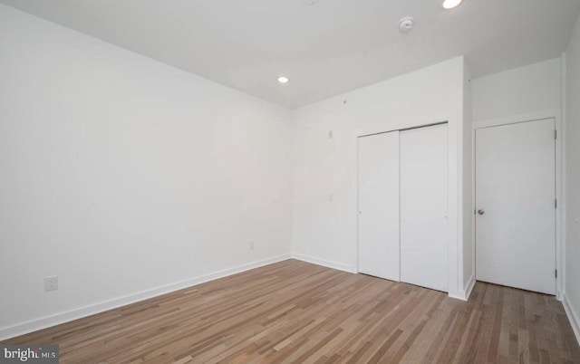 727 N 39th St, Philadelphia, PA 19104 - unfurnished bedroom with baseboards, a closet, recessed lighting, and light wood-style flooring