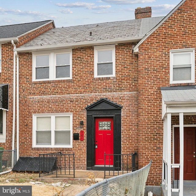 940 E 41st St E, Baltimore, MD 21218 - view of front of home featuring brick siding and fence