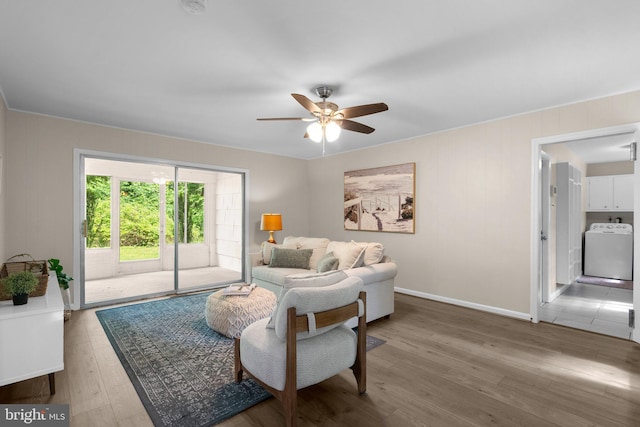 1725 Stratton Rd, Crofton, MD 21114 - living area featuring washer / dryer, ceiling fan, wood finished floors, and baseboards