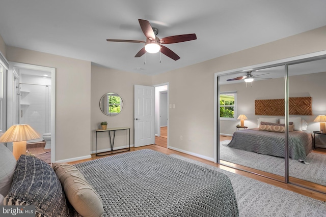 1725 Stratton Rd, Crofton, MD 21114 - bedroom with wood finished floors, baseboards, a closet, a ceiling fan, and connected bathroom