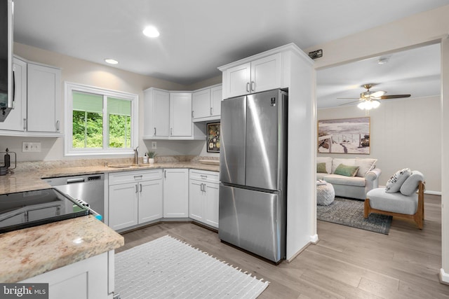 1725 Stratton Rd, Crofton, MD 21114 - kitchen featuring freestanding refrigerator, white cabinets, light wood-type flooring, ceiling fan, and recessed lighting