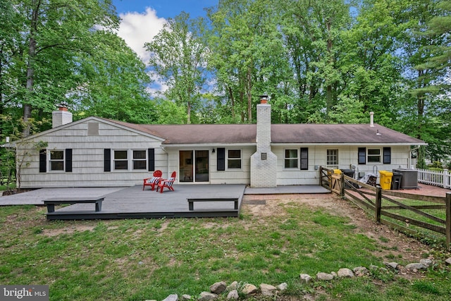 1725 Stratton Rd, Crofton, MD 21114 - rear view of house featuring a chimney, a wooden deck, and view of wooded area