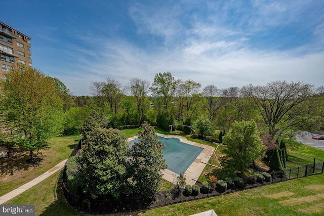 1030 E Lancaster Ave Unit 330, Bryn Mawr, PA 19010 - view of swimming pool featuring fence and a lawn