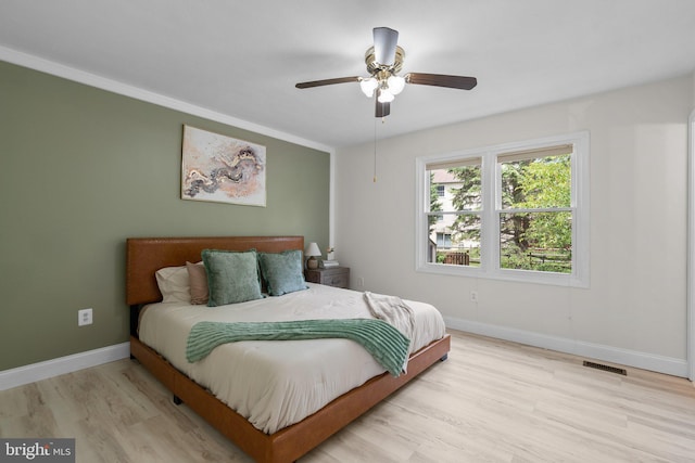 13405 Wisteria Dr, Germantown, MD 20874 - bedroom featuring baseboards, wood finished floors, and a ceiling fan