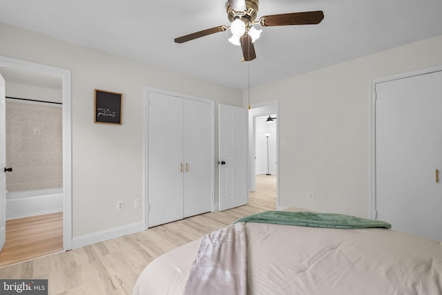 13405 Wisteria Dr, Germantown, MD 20874 - bedroom with wood finished floors, baseboards, a ceiling fan, and ensuite bath