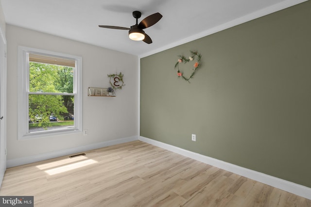 13405 Wisteria Dr, Germantown, MD 20874 - empty room featuring wood finished floors, a ceiling fan, and baseboards