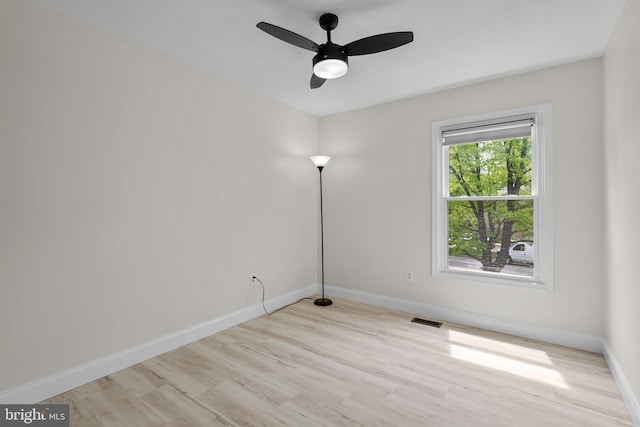 13405 Wisteria Dr, Germantown, MD 20874 - spare room featuring ceiling fan, wood finished floors, and baseboards