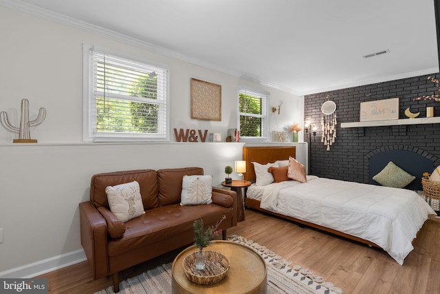 13405 Wisteria Dr, Germantown, MD 20874 - bedroom featuring crown molding, wood finished floors, and baseboards
