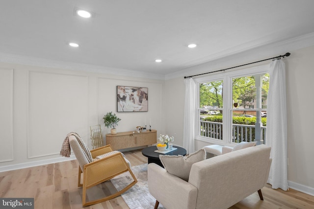 13405 Wisteria Dr, Germantown, MD 20874 - living area featuring crown molding, light wood-type flooring, recessed lighting, and baseboards