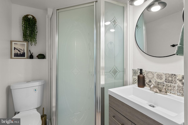 13405 Wisteria Dr, Germantown, MD 20874 - bathroom featuring tasteful backsplash, a shower stall, toilet, and vanity