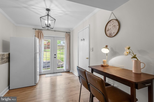13405 Wisteria Dr, Germantown, MD 20874 - entryway with french doors, crown molding, a chandelier, light wood finished floors, and baseboards