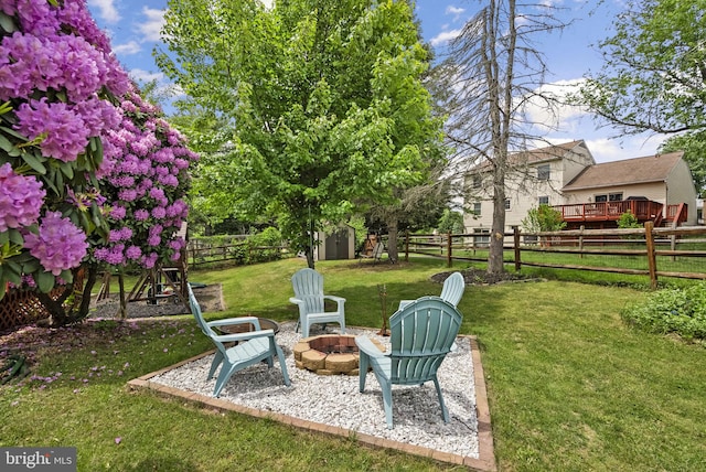 13405 Wisteria Dr, Germantown, MD 20874 - view of yard featuring a fire pit, a storage unit, and an outbuilding