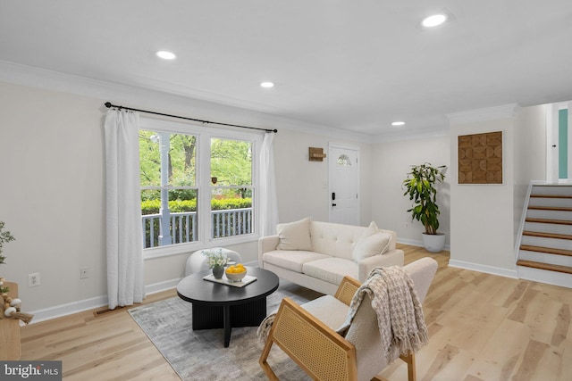 13405 Wisteria Dr, Germantown, MD 20874 - living area with wood finished floors, recessed lighting, ornamental molding, baseboards, and stairway