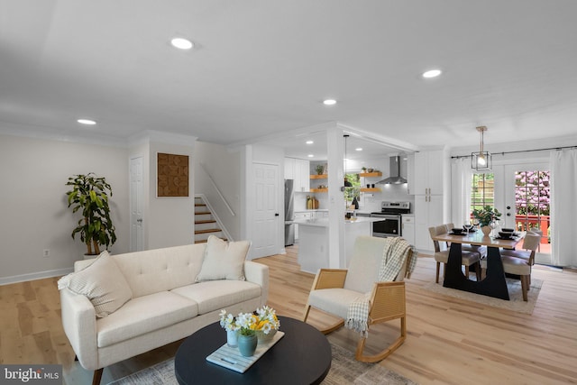 13405 Wisteria Dr, Germantown, MD 20874 - living area with stairs, recessed lighting, light wood-type flooring, and baseboards