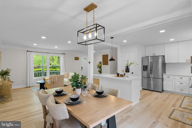 13405 Wisteria Dr, Germantown, MD 20874 - dining area featuring recessed lighting, light wood-style floors, ornamental molding, and baseboards