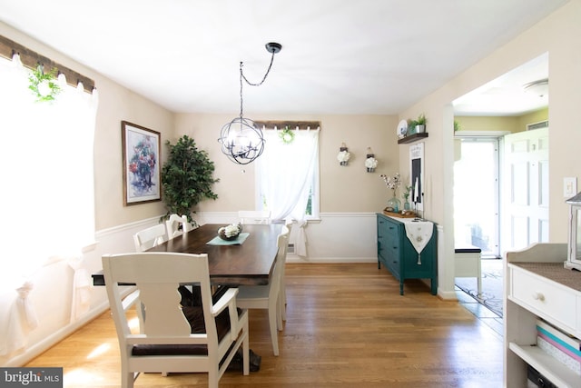 5 Gailridge Ct, Lutherville Timonium, MD 21093 - dining area featuring a chandelier, wood finished floors, and a wainscoted wall