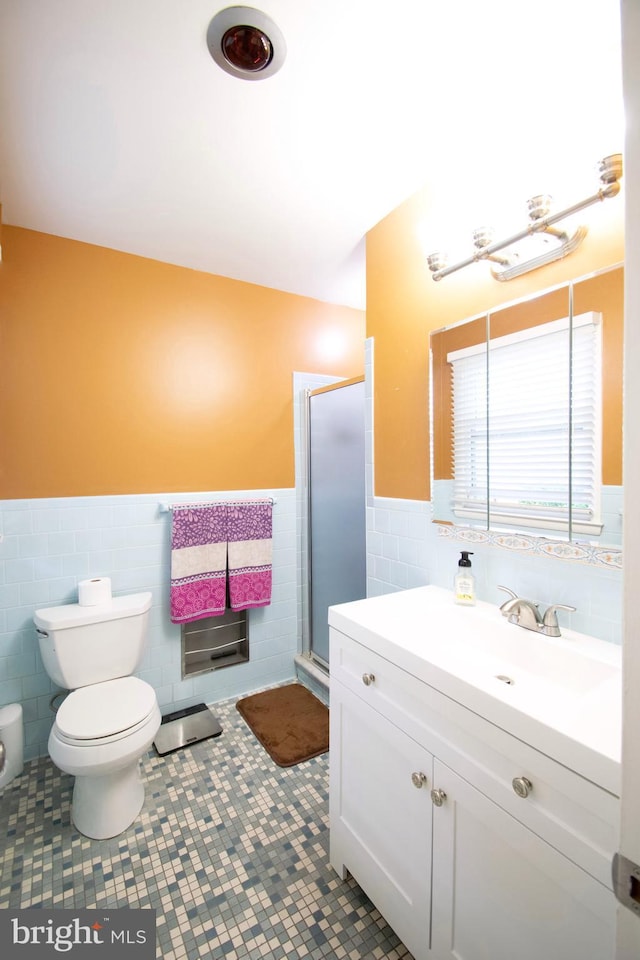 5 Gailridge Ct, Lutherville Timonium, MD 21093 - bathroom featuring tile walls, vanity, toilet, wainscoting, and a stall shower