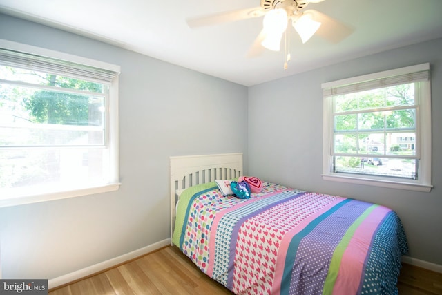 5 Gailridge Ct, Lutherville Timonium, MD 21093 - bedroom with multiple windows, baseboards, and wood finished floors