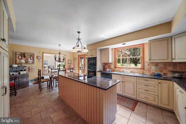101 Harvey Ln, Chadds Ford, PA 19317 - kitchen with plenty of natural light, black appliances, and cream cabinetry
