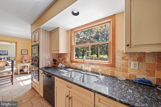 101 Harvey Ln, Chadds Ford, PA 19317 - kitchen with decorative backsplash, cream cabinets, a sink, black appliances, and dark stone countertops