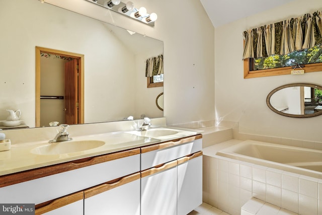 101 Harvey Ln, Chadds Ford, PA 19317 - bathroom featuring double vanity, lofted ceiling, a sink, and a bath