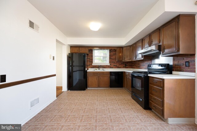 11 Whitekirk Dr, Wilmington, DE 19808 - kitchen featuring visible vents, light countertops, under cabinet range hood, and black appliances
