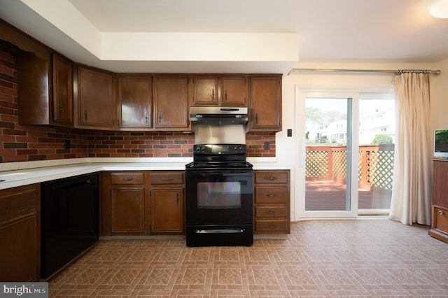 11 Whitekirk Dr, Wilmington, DE 19808 - kitchen with light countertops, tasteful backsplash, black appliances, and under cabinet range hood
