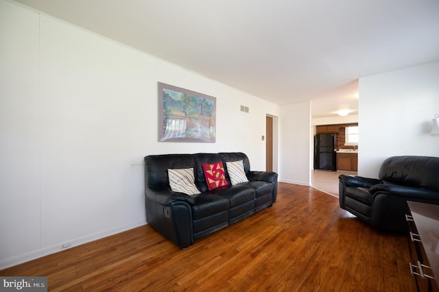 11 Whitekirk Dr, Wilmington, DE 19808 - living area with baseboards, wood finished floors, and visible vents