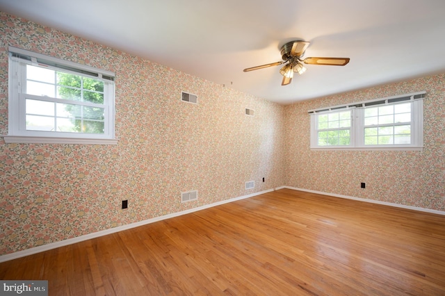 11 Whitekirk Dr, Wilmington, DE 19808 - spare room with ceiling fan, visible vents, a healthy amount of sunlight, and light wood-type flooring