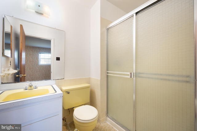 11 Whitekirk Dr, Wilmington, DE 19808 - full bathroom featuring tile walls, a shower with shower door, vanity, and toilet