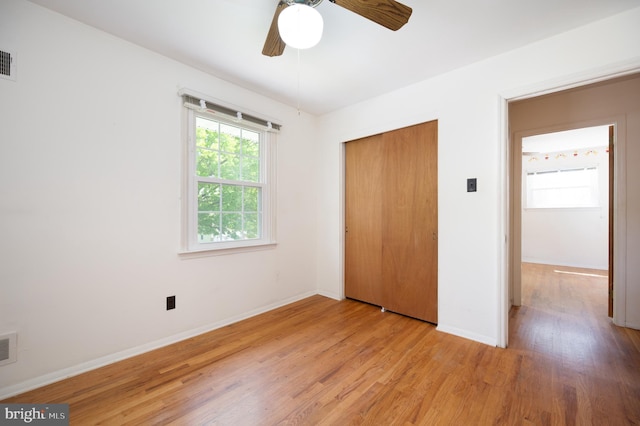 11 Whitekirk Dr, Wilmington, DE 19808 - unfurnished bedroom with light wood-style flooring, a ceiling fan, baseboards, visible vents, and a closet