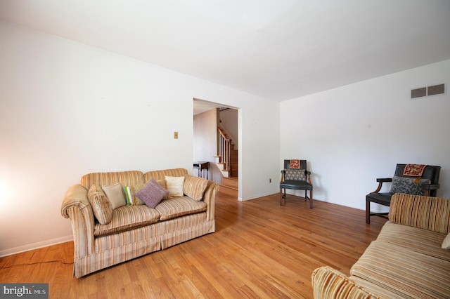 11 Whitekirk Dr, Wilmington, DE 19808 - living room with visible vents, baseboards, stairs, and wood finished floors