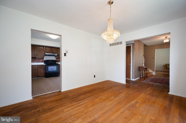 11 Whitekirk Dr, Wilmington, DE 19808 - unfurnished dining area with visible vents, light wood finished floors, baseboards, and a chandelier