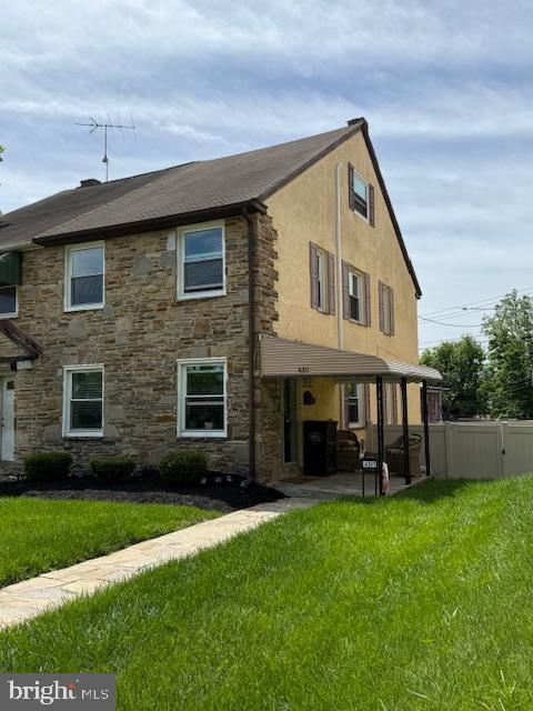 4311 Chatham Rd, Baltimore, MD 21207 - rear view of property with stone siding and a patio