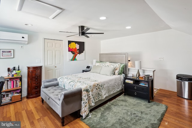 4311 Chatham Rd, Baltimore, MD 21207 - bedroom featuring a wall unit AC, attic access, a closet, wood finished floors, and recessed lighting