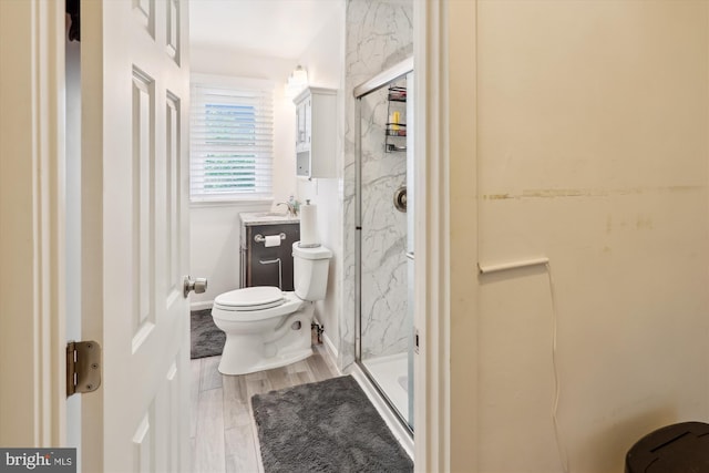 4311 Chatham Rd, Baltimore, MD 21207 - bathroom featuring toilet, a marble finish shower, vanity, and wood finished floors