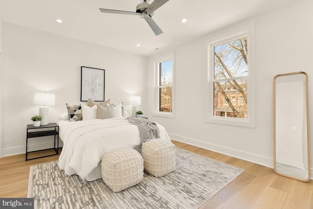 bedroom featuring recessed lighting, baseboards, ceiling fan, and light wood-type flooring
