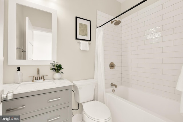 full bathroom featuring vanity, toilet, and shower / bath combination with curtain