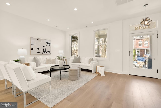 living room featuring visible vents, recessed lighting, light wood-style flooring, and baseboards
