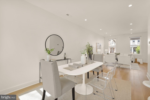 dining space featuring baseboards, recessed lighting, light wood-style flooring, and visible vents