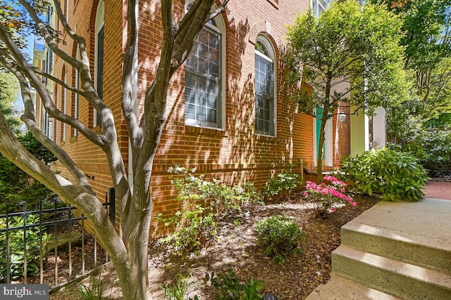 217 Hart Rd, Gaithersburg, MD 20878 - view of side of home with brick siding and fence
