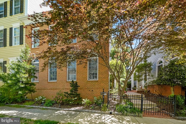 217 Hart Rd, Gaithersburg, MD 20878 - view of property exterior with brick siding and fence
