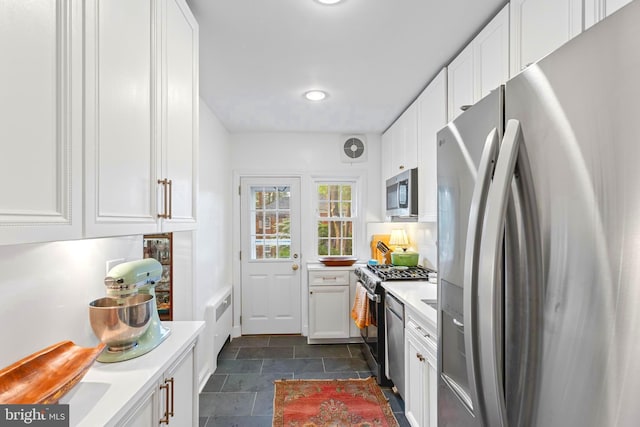 110 Murdock Rd, Baltimore, MD 21212 - kitchen with stainless steel appliances, light countertops, white cabinets, and recessed lighting