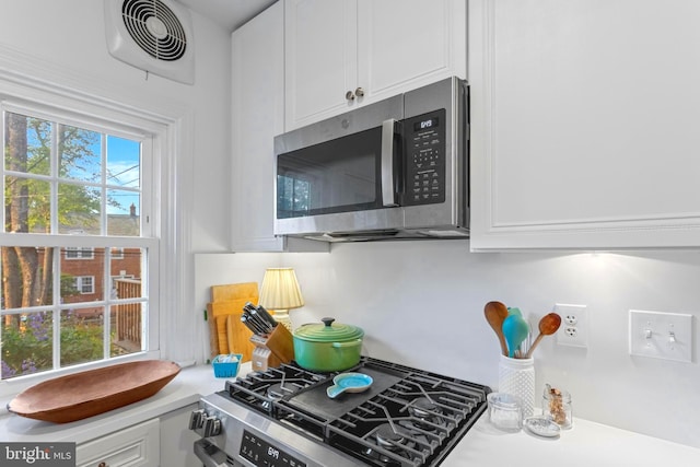 110 Murdock Rd, Baltimore, MD 21212 - kitchen with appliances with stainless steel finishes, white cabinets, and light countertops
